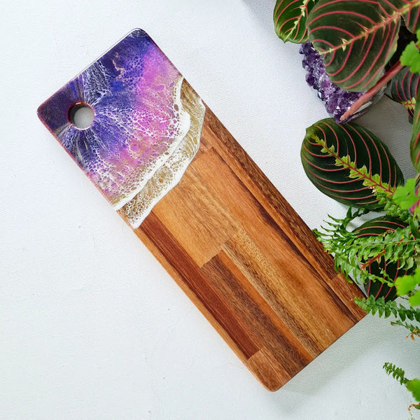 400 by 150 millimeter grazer with Amethyst Purple Epoxy Resin Waves on one end, also includes a hole on the wave end for easy hanging. Handcrafted at Chaos By Design Nz studios based in Eketahuna Nz